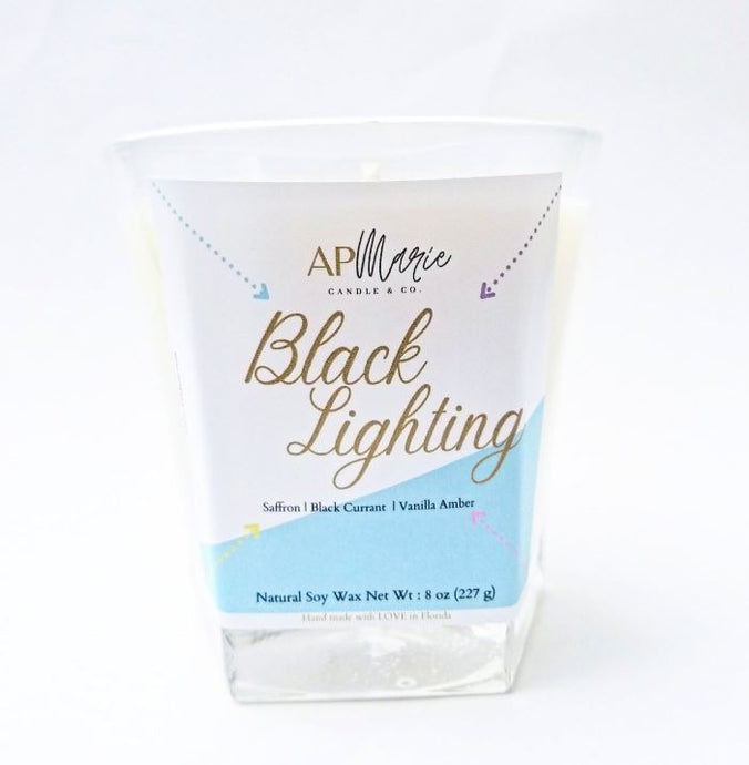 AP Marie glass  soy candle blacklighting with  safffron and black currant in Florida